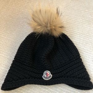 Moncler black hat with tan pom pom